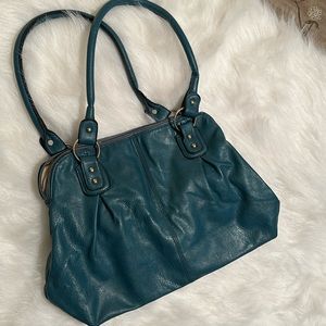 Teal purse. Does not have tags for brand. Soft Leather like.